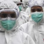 Petugas kesehatan Rumah Sakit COVID-19 Wisma Atlet berjalan untuk berganti jaga di Jakarta, Jumat (26/2/2021).